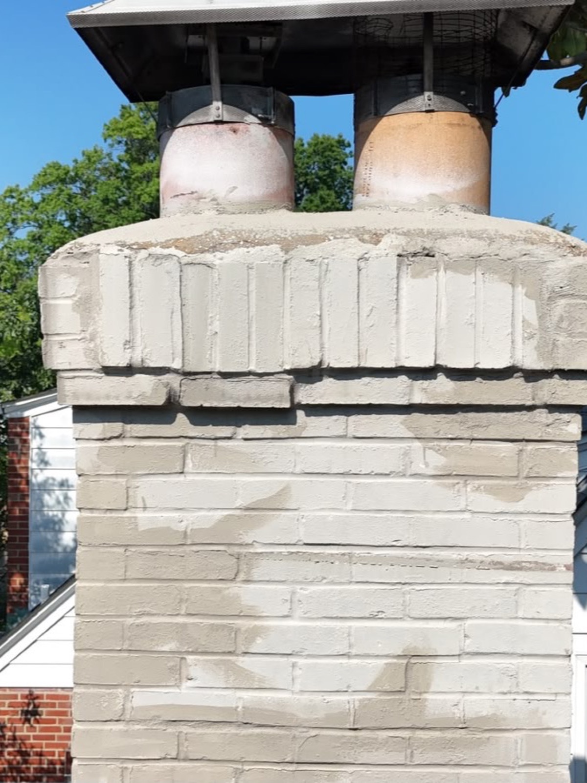 Soldier stack of vertical bricks at the chimney top separating and opening at the joints
