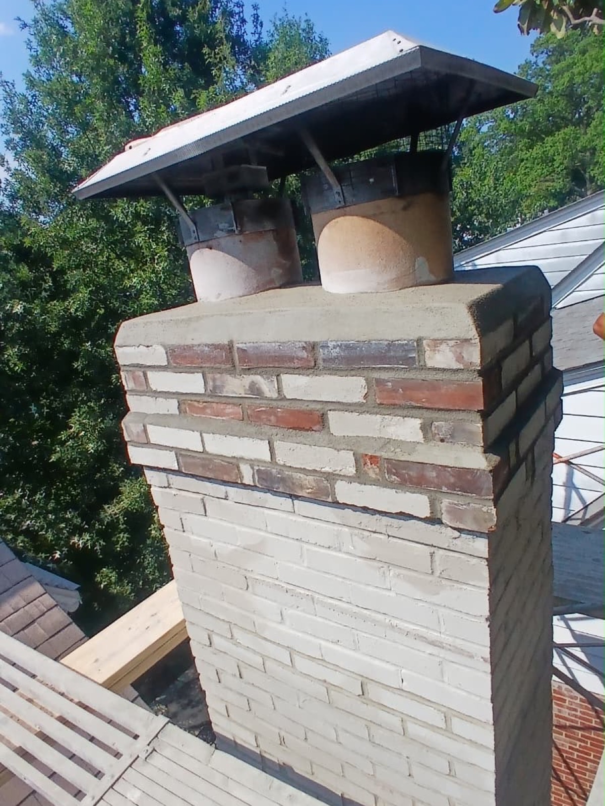 Chimney top rebuilt with the bricks laid horizontal instead of standing vertical