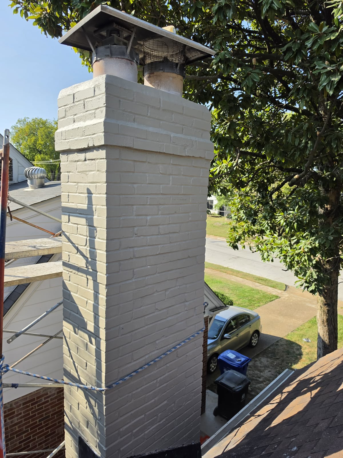 The finished chimney top with the cap back on above the new crown