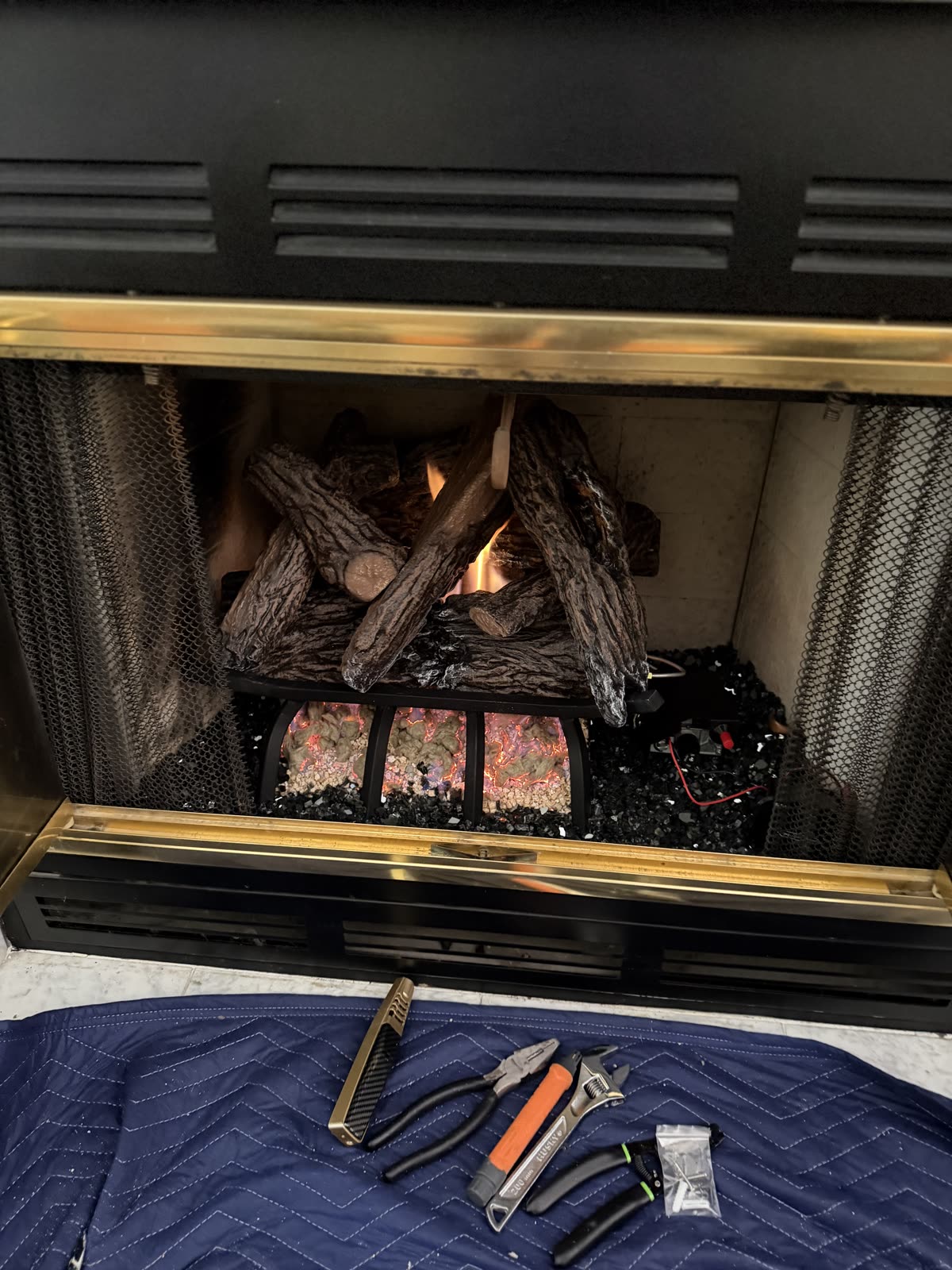 The same fireplace running after AirPlease Missouri Chimney Services installed the new gas system
