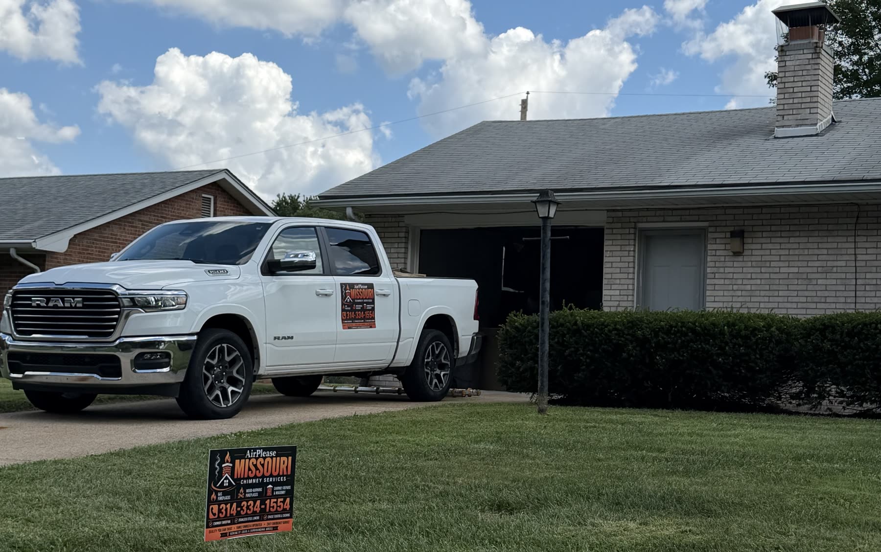 AirPlease Missouri Chimney Services truck and yard sign outside a St. Louis area home during a chimney job