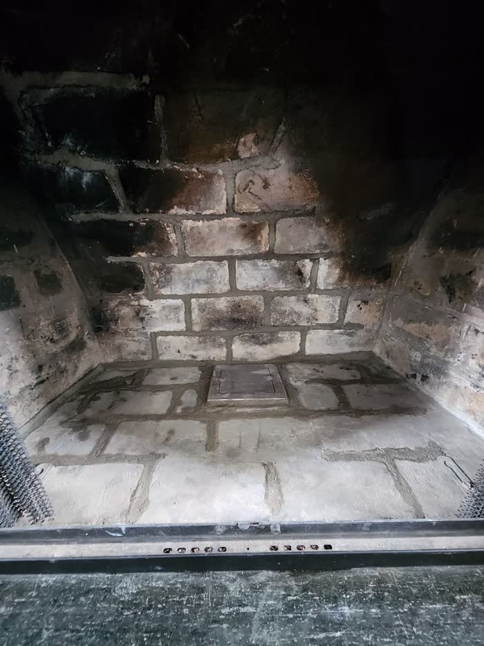 Masonry restoration work in progress on the chimney