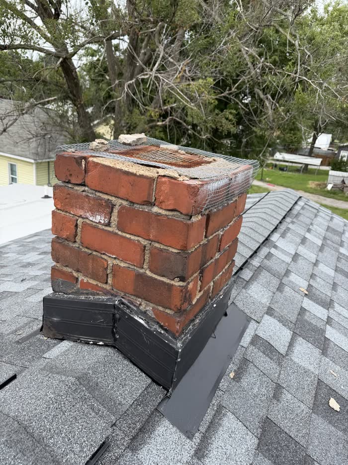 New brick courses laid during the full chimney rebuild